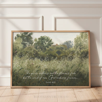The image is a framed painting depicting a lush, green landscape with trees and grass, accompanied by a Bible verse from Isaiah 40:8.