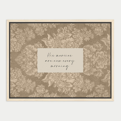 a framed print with a floral pattern and a handwritten message in the center.