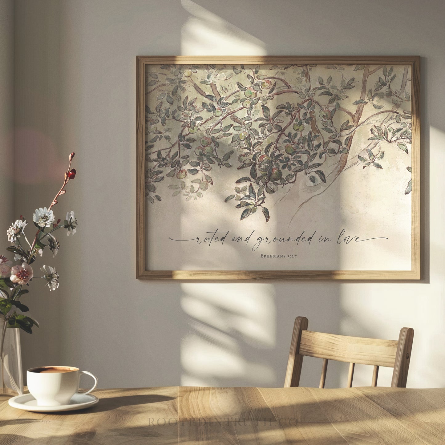 A Christian vintage wall art print with a scripture bible verse above a dining room table.