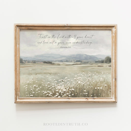 The image is a framed print depicting a serene landscape with a field of white flowers and mountains in the background. The text overlay on the image reads "Trust in the Lord with all your heart and lean not on your own understanding."