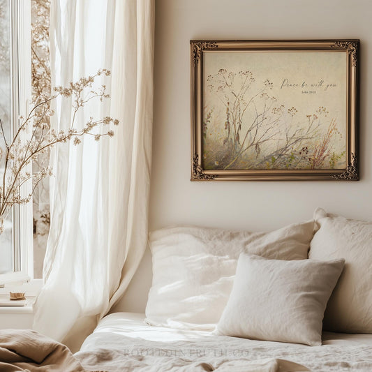 a bed with a white comforter and a painting on the wall